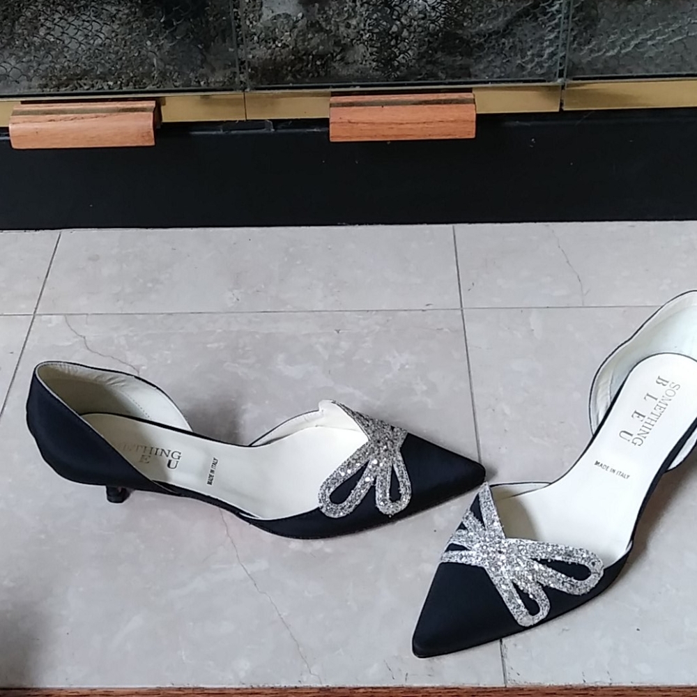 Black satin pumps